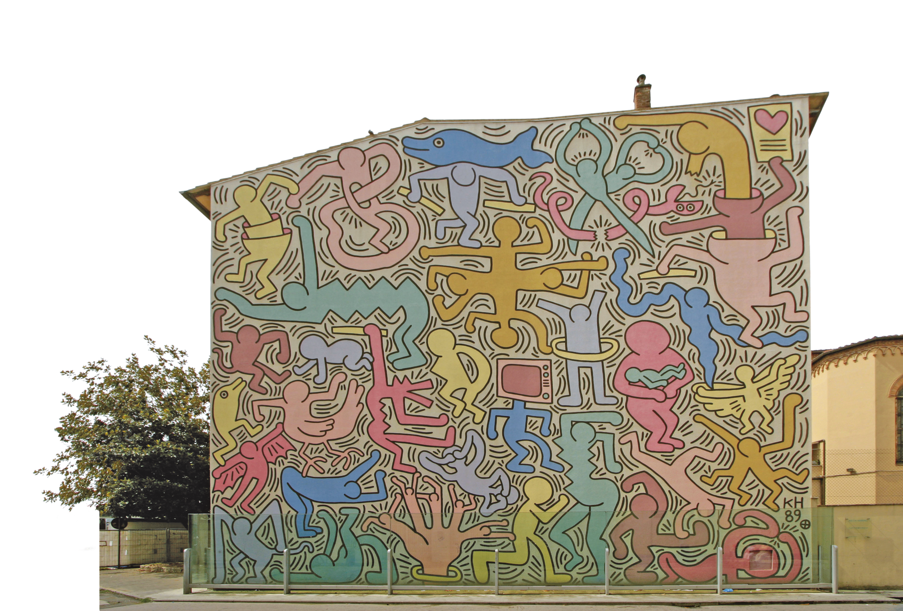 Fotografia. Pintura mural realizada na parede lateral de uma casa de dois andares. A parede foi toda recoberta por figuras compostas de formas de pessoas, objetos e animais unidas. As figuras são colorida de azul, verde, tons de rosa, amarelo e laranja.