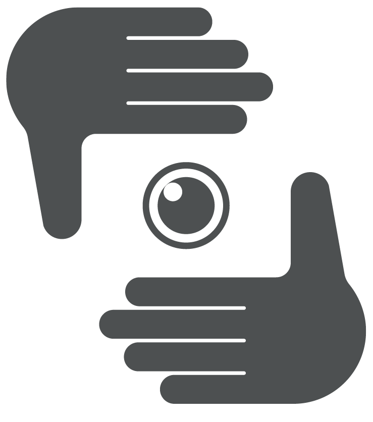 Ilustração. Duas mãos em sentidos opostos formam um gesto de enquadramento de cena. A imagem enquadrada no centro é uma espécie de olho ou lente de uma câmera fotográfica.