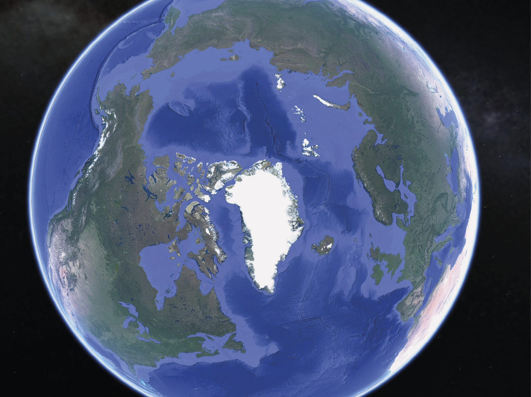 Imagem de satélite. 
Imagem de satélite do planeta terra. No centro da imagem, a região do Ártico coberta de gelo. No entorno, partes azuis representando as águas oceânicas e os continentes eurasiano à direita e americano à esquerda.