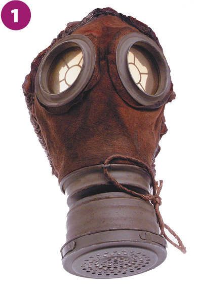 Fotografia 1. Uma máscara marrom, com duas formas arredondadas transparentes na parte superior, destinadas a proteger os olhos, e um filtro de ar na parte inferior.