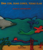 Imagem: Capa do livro. Na parte superior, o título “Uma cor, duas cores, todas elas”. Apresenta o mar verde com sereia, peixes, algas e um golfinho. O fundo é azul e há a faixa de areia no fundo do mar.  Fim da imagem.