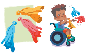 Imagem: Ilustração. Três lenços coloridos com um anel na ponta.  Ilustração. Um menino com cabelos crespos, usando camiseta azul e short, sentado em uma cadeira de rodas segurando um lenço com a mão e dois no ar.  Fim da imagem.