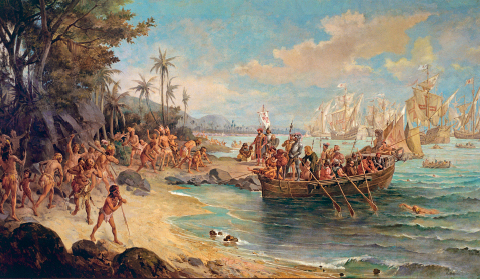 Imagem: Ilustração. Homens e mulheres indígenas na beira do mar em uma praia observando a chegada de navios repletos de homens brancos. Fim da imagem.