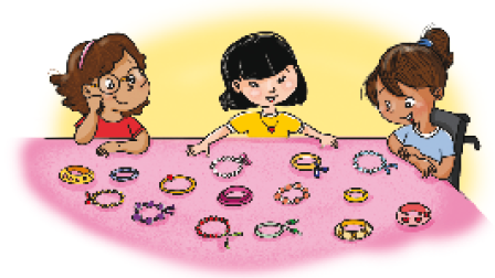 Imagem: Ilustração. Três meninas estão observando quinze pulseiras coloridas sobre uma mesa.  Fim da imagem.