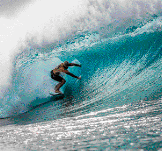 Imagem: Fotografia. Uma pessoa está em pé, sobre uma prancha de surf e dentro de uma onda.  Fim da imagem.