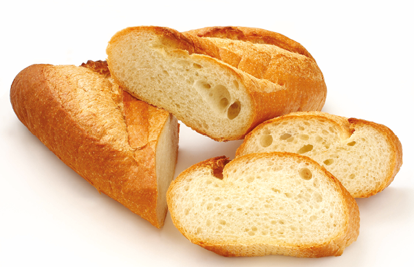 Fotografia. Pão cortado em fatias ovaladas.