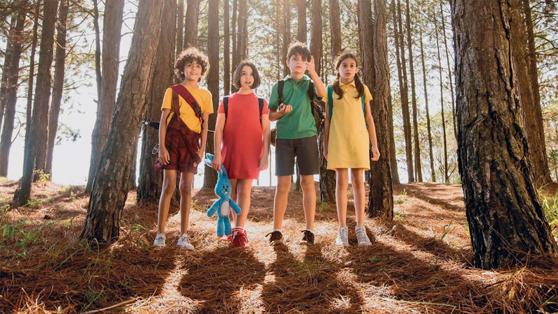 IMAGEM: Início da unidade cinco. na cena do filme turma da mônica laços, quatro crianças estão em um bosque, entre árvores. são: cascão, mônica, cebolinha e magali. eles olham atentamente para algo. FIM DA IMAGEM.