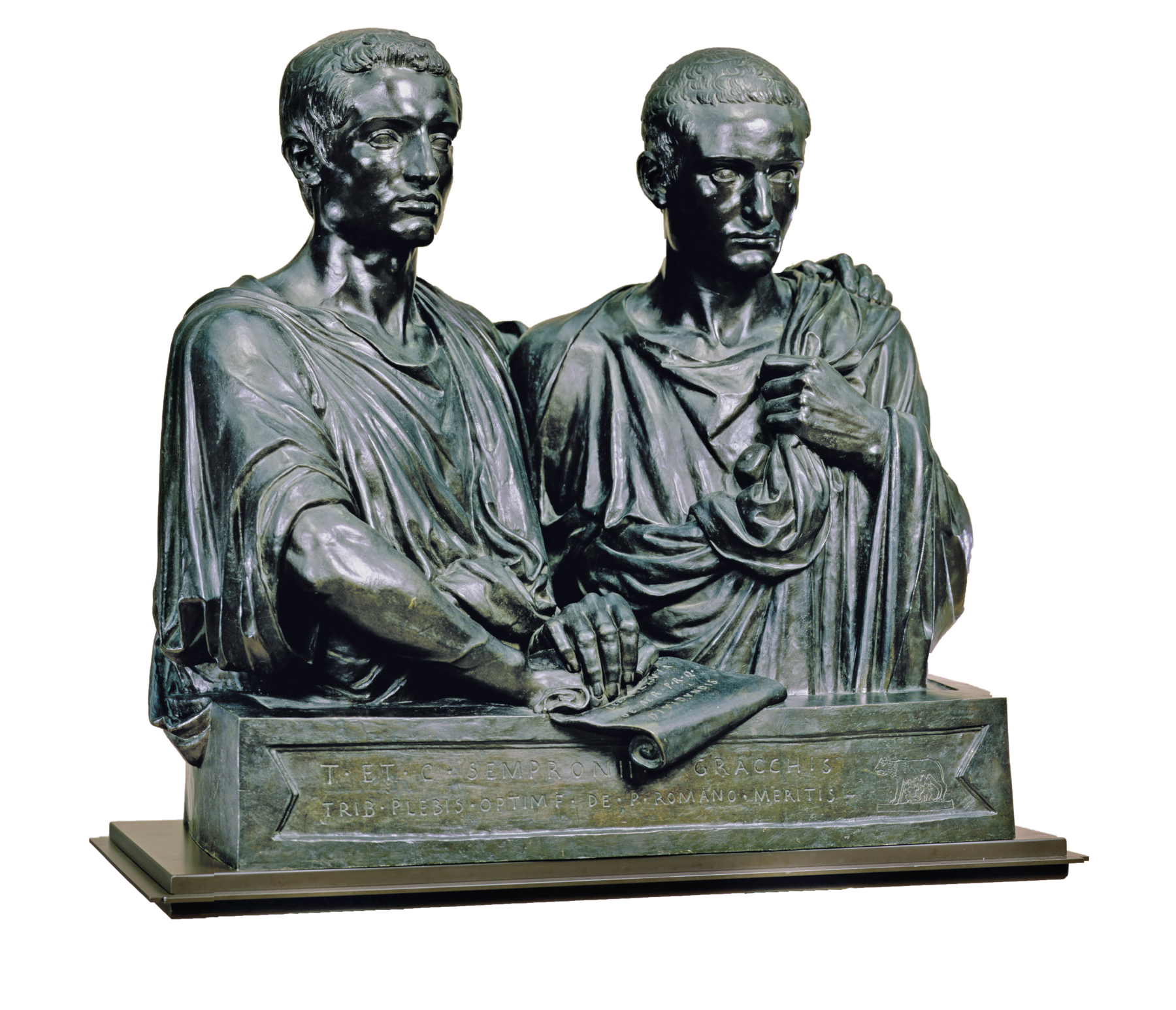 Escultura. Busto de dois homens, lado a lado, ambos com cabelos lisos e curtos, vestindo togas. Os dois apoiam uma das mãos sobre uma folha de papel com textos escritos.