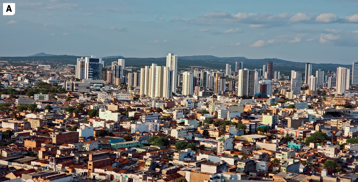 Fotografia. A. Vista de uma cidade com uma concentração de edifícios altos, de vários andares, no centro da imagem. Ao redor dessa área central, casas, sobrados e prédios mais baixos. Na parte de cima da fotografia, ao fundo, vista de uma área mais elevada com morros e vegetação.