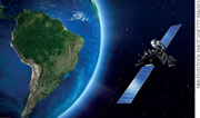 IMAGEM: um satélite de comunicação em órbita do planeta terra. FIM DA IMAGEM.