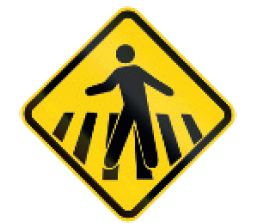 IMAGEM: placa em formato de losango com o desenho de um homem andando em uma faixa de pedestres. FIM DA IMAGEM.