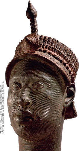 IMAGEM: cabeça de um homem esculpida em bronze, ornada com uma espécie de coroa. FIM DA IMAGEM.