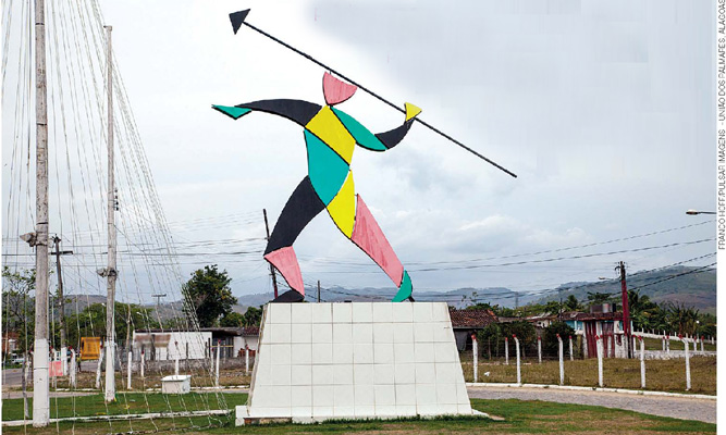 IMAGEM: representação estilizada de uma figura humana posicionando-se para jogar uma lança. FIM DA IMAGEM.