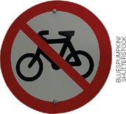 IMAGEM: placa de sinalização redonda, com o desenho de uma bicicleta no centro e uma linha vermelha traçada na diagonal. FIM DA IMAGEM.
