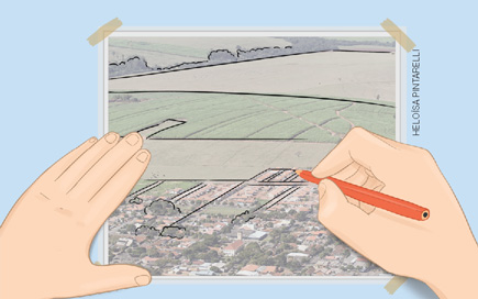 IMAGEM: duas mãos desenham um croqui de uma paisagem em uma folha de papel vegetal, por cima de uma foto da paisagem. FIM DA IMAGEM.