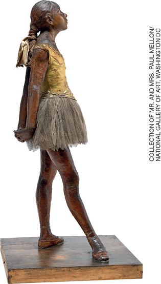 IMAGEM: escultura de uma jovem bailarina que está de pé, ereta, com os braços para trás. ela usa os cabelos presos em fitas, veste um bóri, tutu de balé e sapatilhas. FIM DA IMAGEM.