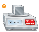 IMAGEM: um cubo de metal está sobre uma balança digital. o peso indicado no visor é de 90,40 gramas. FIM DA IMAGEM.