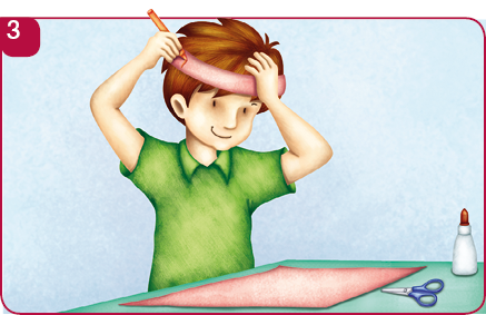 Imagem: Ilustração 3. O menino está segurando a faixa da cartolina em volta da testa. Na frente dele, a cartolina, a tesoura e o tubo de cola sobre a mesa.   Fim da imagem.