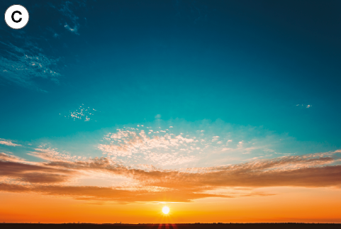 Imagem: Fotografia. C: Céu laranja intenso com o pôr-do-sol.  Fim da imagem.