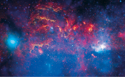Imagem: Fotografia. Via Láctea com estrelas e poeira estelar em tons de vermelho, azul e roxo. Fim da imagem.