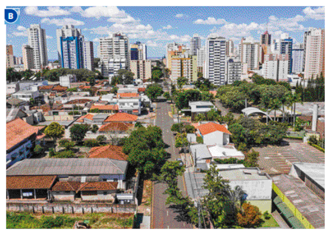 Imagem: Fotografia B. Vista aérea de uma avenida. Em volta há casas, prédios e árvores. Fim da imagem.