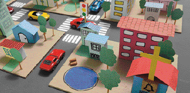 Imagem: Ilustração. Maquete de um bairro. Há ruas com carros, casas, prédios e um lago rodeado por ár-vores.  Fim da imagem.