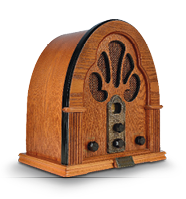 Imagem: Fotografia. Um rádio antigo de madeira. Fim da imagem.