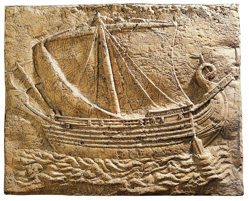 Imagem: Fotografia. Desenho em relevo de uma grande embarcação no mar feito sobre uma superfície rochosa com fissuras. Fim da imagem.