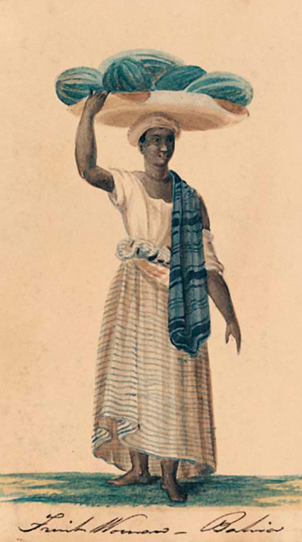 Imagem: Pintura. Uma mulher negra de pé equilibrando uma bandeja com frutas sobre a cabeça. Ela usa uma camiseta larga clara, com uma longa saia, está descalça e está com um tecido estampado sobre o ombro esquerdo. Na parte inferior, há uma assinatura. Fim da imagem.