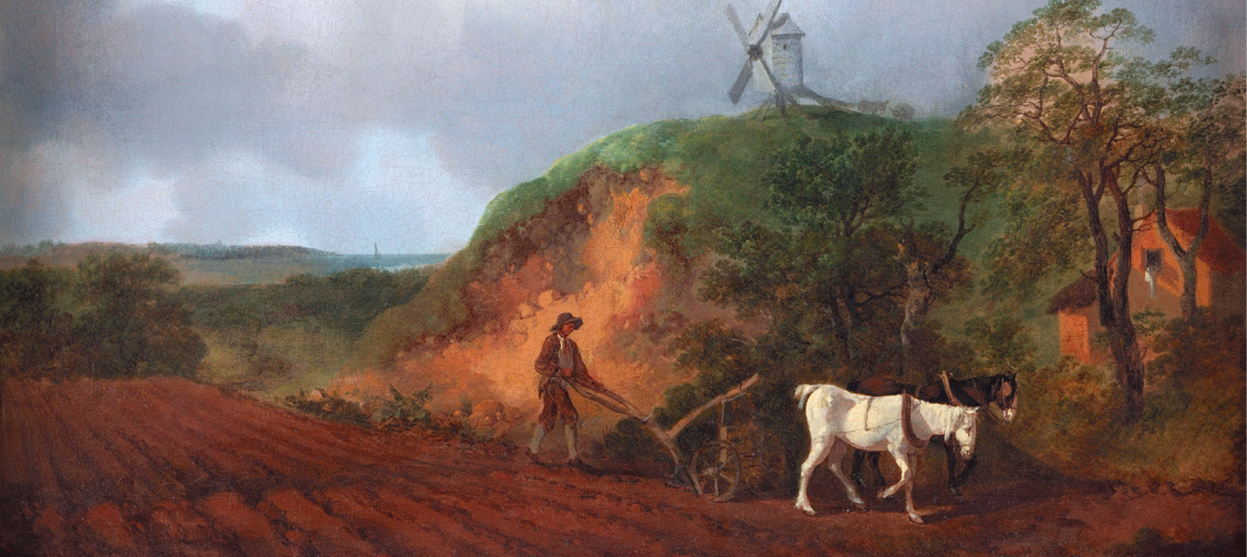 Pintura. Pessoa arando a terra com o auxílio de dois animais que puxam o arado. À direita, um moinho no alto do morro e uma pequena casa entre as árvores.