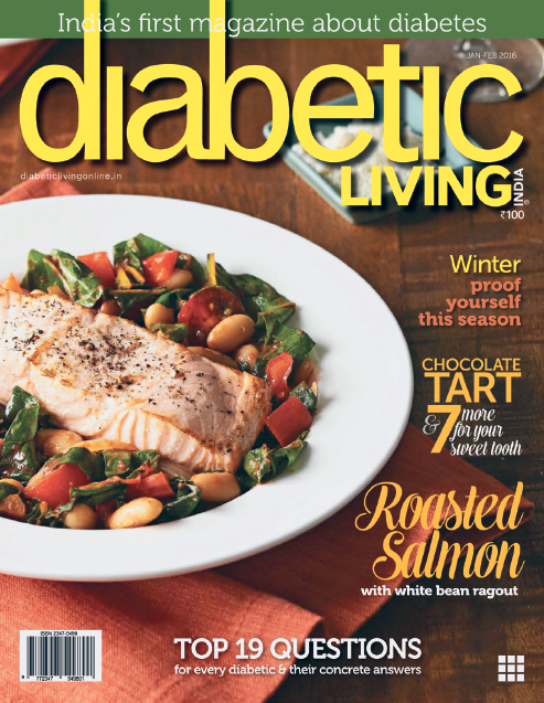 Fotografia quatro. Capa de revista. Na parte superior, título: Diabetic Living. Sobre uma mesa de madeira escura, com um prato à esquerda, redondo e branco, com alimentos dentro, posta de salmão na cor laranja-claro e legumes coloridos e folhas verdes. Sobre a foto, nos cantos da capa, há chamadas diversas para as matérias dentro da revista.