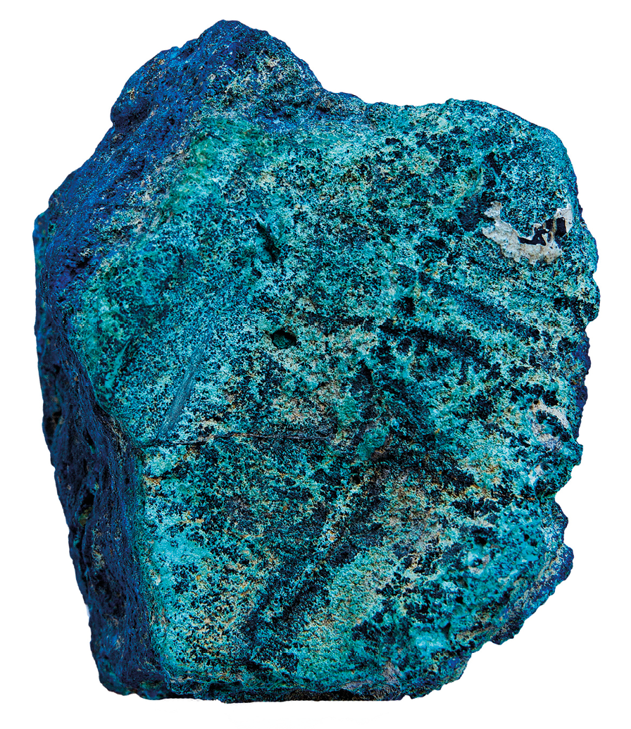 Fotografia. Pedra azul de formato irregular e aspecto áspero e poroso.