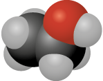 Ilustração. Dois átomos pretos; ao redor deles, seis átomos cinzas e um átomo vermelho.