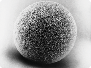 Fotografia de uma esfera com uma superfície de aspecto poroso.
