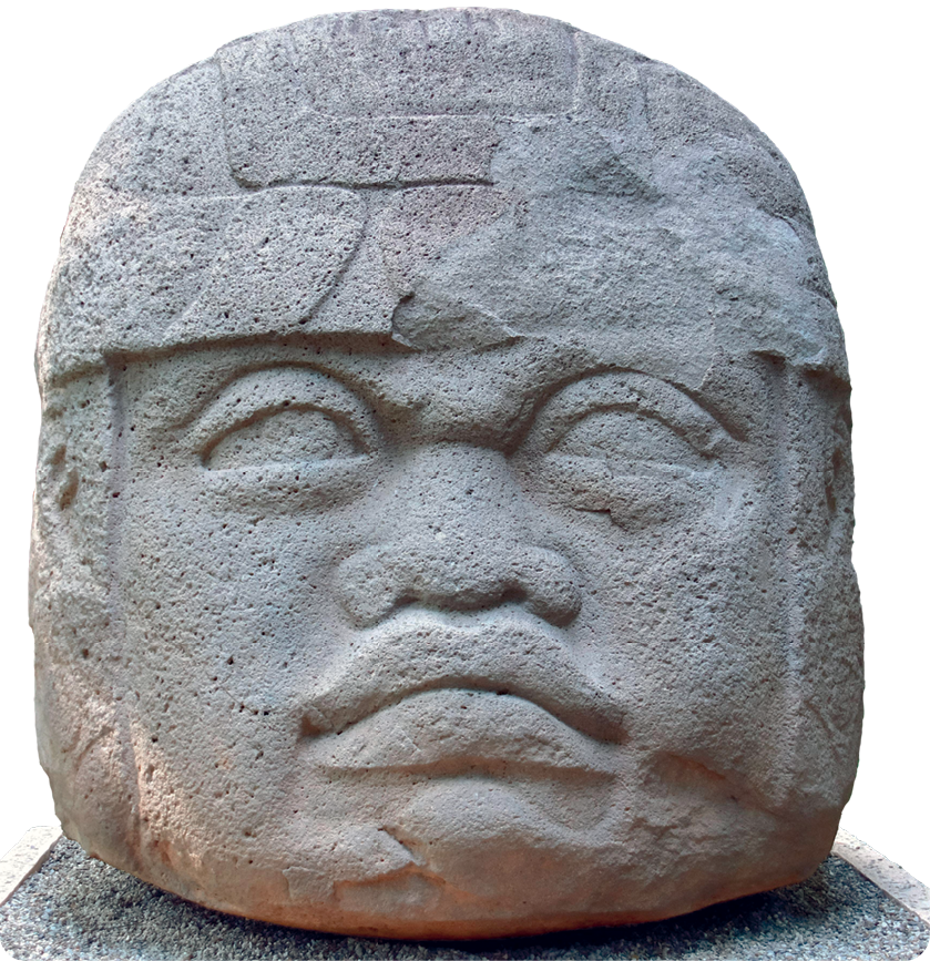 Escultura. Rosto de pedra uma pessoa com nariz e lábios grossos.