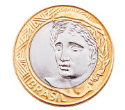 Fotografia de uma moeda de 1 real na face cara. Há o rosto de uma pessoa e está escrito embaixo 'Brasil'.
