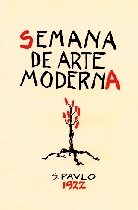 Cartaz. Cartaz vertical de cor bege-claro. Ao centro, ilustração de uma árvore preta com folhas em vermelho acima, com raízes ramificadas. Na parte superior, texto: SEMANA DE ARTE MODERNA. Abaixo, texto: S. Paulo 1922.